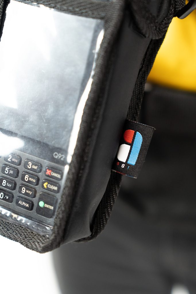 Custom payment terminal holder integrated into an Innov Back Pack bag.