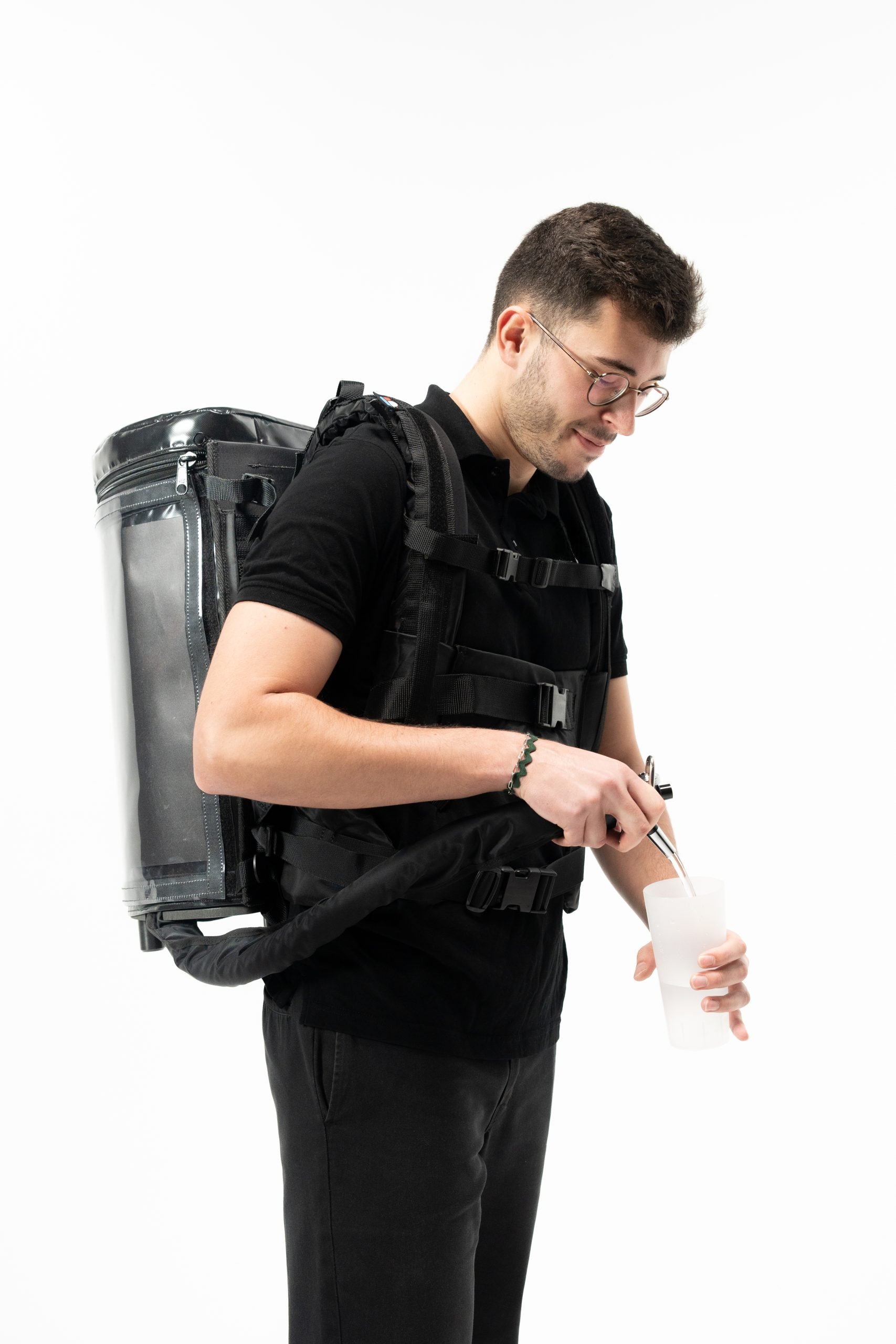 Server wearing DraftGo backpack serving soft drinks or draft beer at an event.
