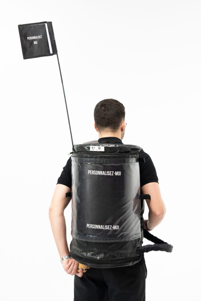 Back view of server wearing the customizable Mini Combo Bag for serving hot or cold still drinks.