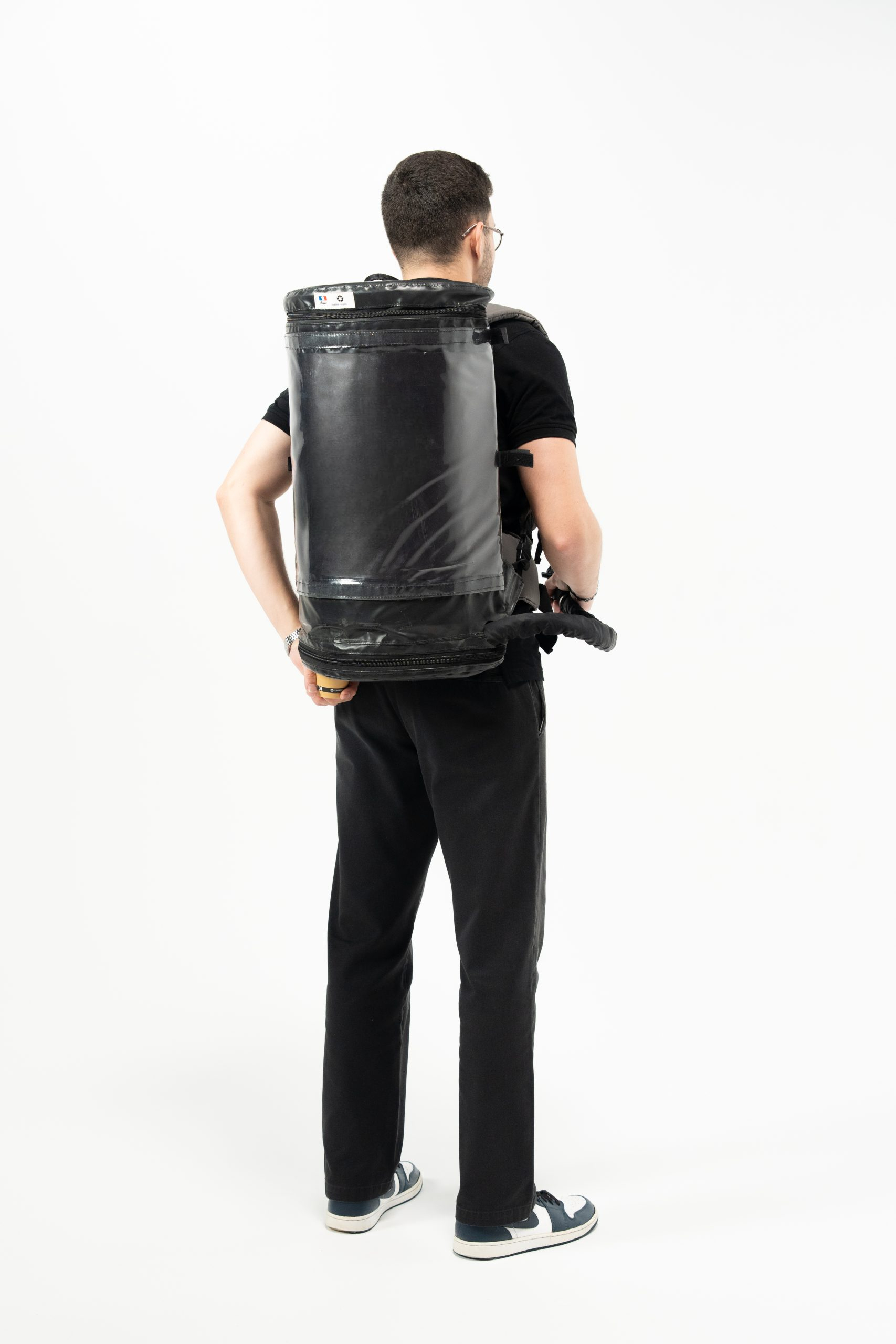 Back view of server wearing the Mini Combo Bag for mobile service of hot or cold still drinks.